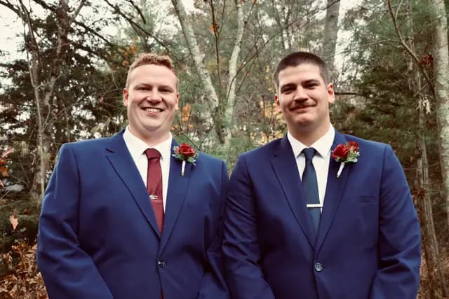 Close portrait of the groom and best man smiling