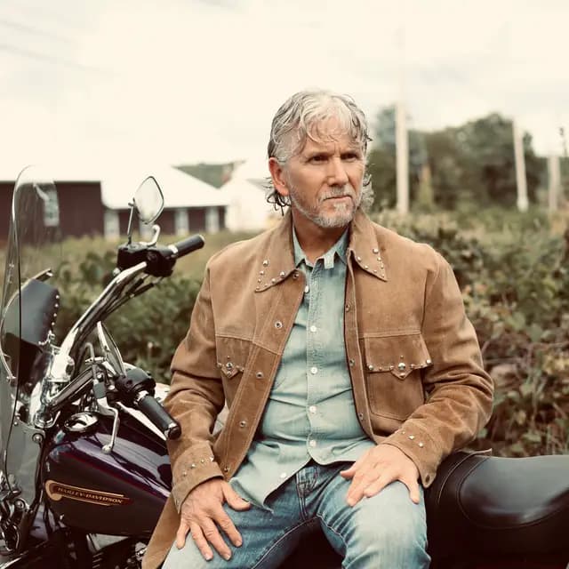 Warm-toned look off camera while seated on the bike
