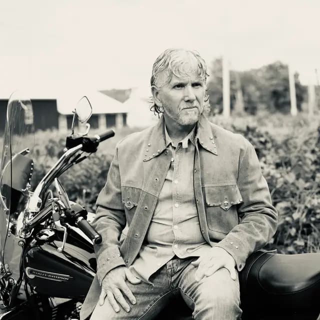 Black and white profile gaze from the motorcycle seat