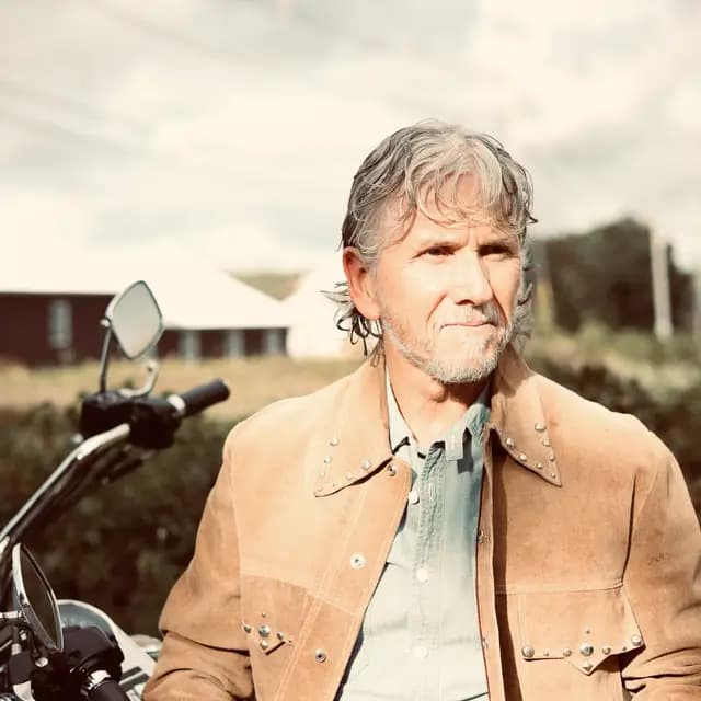 Warm-toned direct portrait in the studded suede jacket