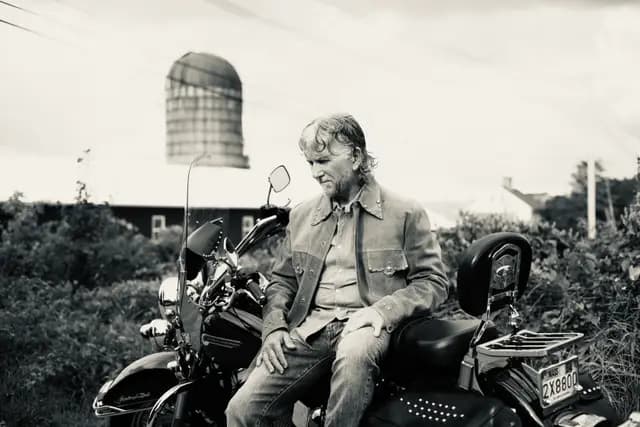 Black and white wide shot on the bike, silo overhead