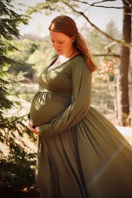 Soft light on a quiet look down at her belly